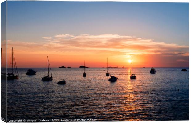 A warm sunset with the sun reflecting on the surface of the sea, Canvas Print by Joaquin Corbalan