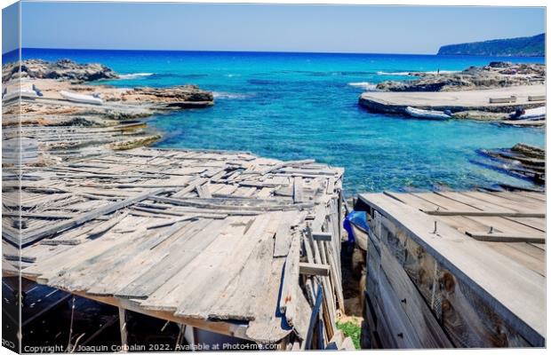 Traditional rustic pier with wooden boards in a cove in Formente Canvas Print by Joaquin Corbalan