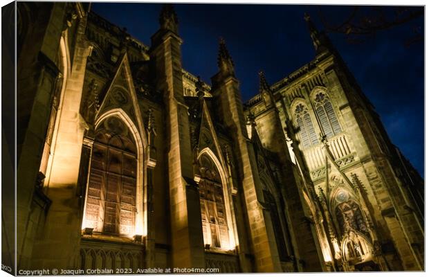 The cathedral of San Sebastian is illuminated at night in a ghos Canvas Print by Joaquin Corbalan