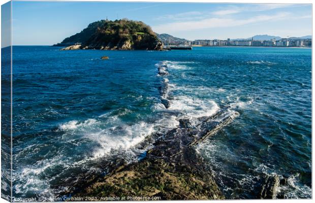 The sea beats hard on the coast and leaves visible geological fo Canvas Print by Joaquin Corbalan