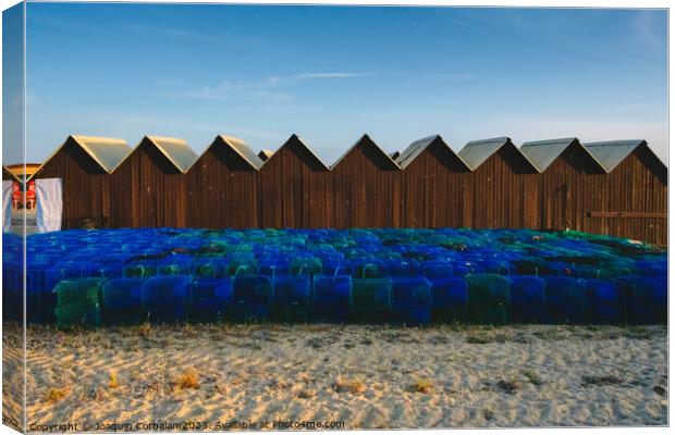 Pots, baskets and traps for fishing, piled up on the coast. Canvas Print by Joaquin Corbalan