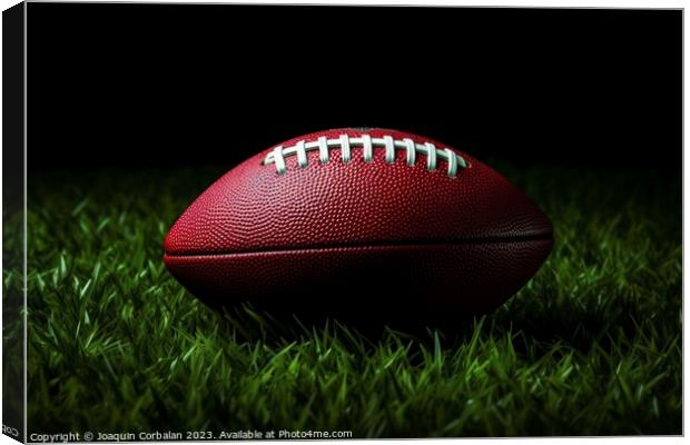 A well-worn American football rests on the lush green grass of a Canvas Print by Joaquin Corbalan