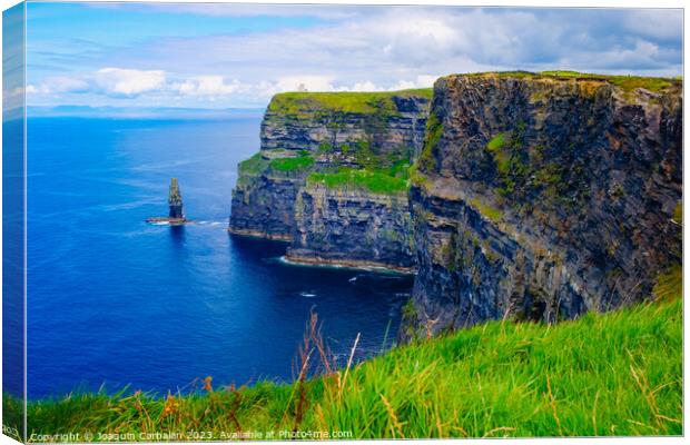 Beautiful view of the Cliffs of Moher, a calm blue sea with copy space. Canvas Print by Joaquin Corbalan