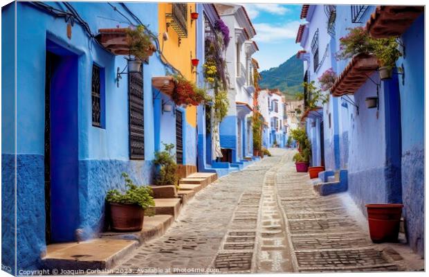 Beautiful houses painted in blue in a Moroccan vil Canvas Print by Joaquin Corbalan