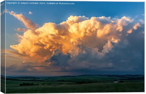 A massive, dramatic cloud looming in the sky, creating a striking scene. Canvas Print by Joaquin Corbalan