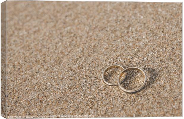 Wedding rings for the bride and groom. Canvas Print by Joaquin Corbalan