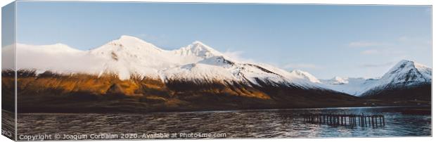 Beautiful scene of a landscape with high snowy mountains and sea. Canvas Print by Joaquin Corbalan
