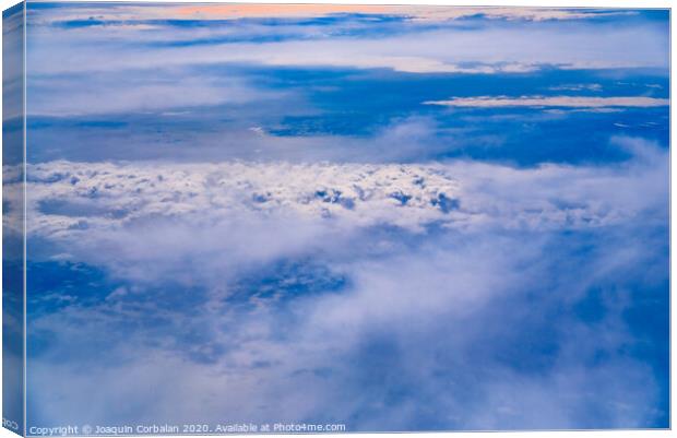 Sea of blue and white clouds seen from above. Canvas Print by Joaquin Corbalan