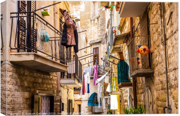 Colorful and old alleys of the touristic Italian city of Bari. Canvas Print by Joaquin Corbalan
