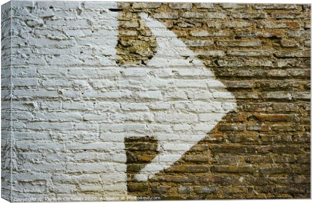 Brick wall with big white arrow indicating direction, background with copy space. Canvas Print by Joaquin Corbalan
