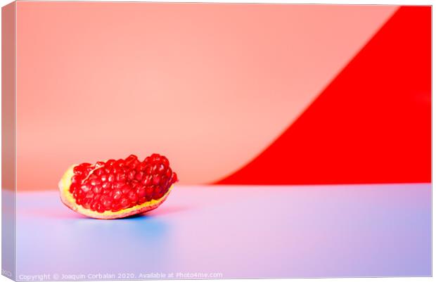 Autumn is the time of pomegranates, open fruit isolated on plain colored backgrounds. Canvas Print by Joaquin Corbalan