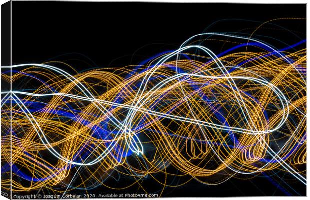 Colorful light painting with circular shapes and abstract black background. Canvas Print by Joaquin Corbalan