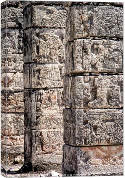 Carved stone columns with Mayan images in Chichen Itza, Mexico. Canvas Print by Joaquin Corbalan