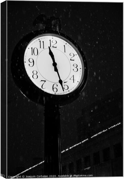Street clock during a snowfall, time passes. Canvas Print by Joaquin Corbalan