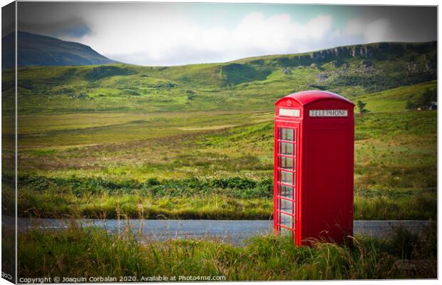 Typical red English telephone box in a rural area near a road. Canvas Print by Joaquin Corbalan