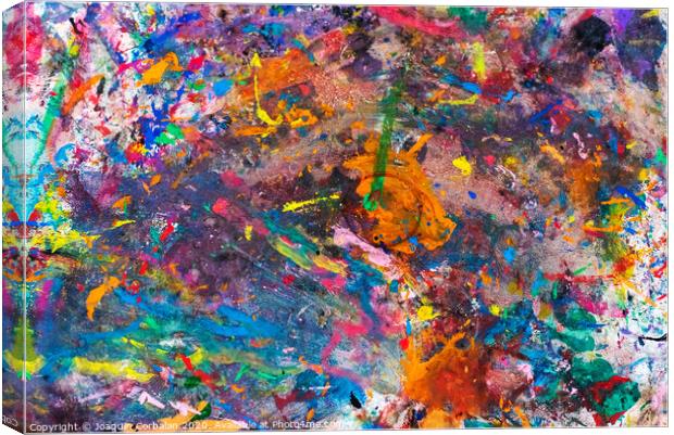 Painter's table littered with paint stains. Canvas Print by Joaquin Corbalan