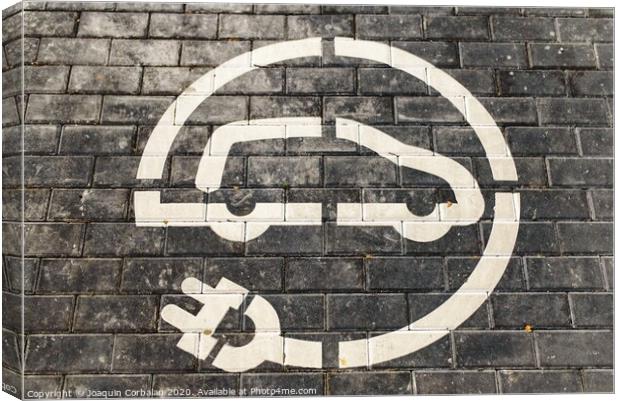 Roadsign of free electric car charging station in a European supermarket parking lot. Canvas Print by Joaquin Corbalan