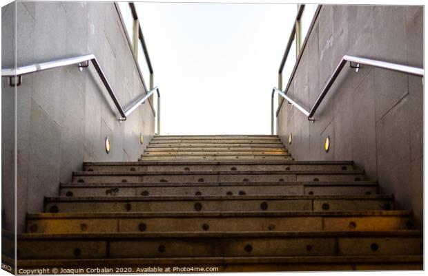 Granite staircase with handrails at the entrance of an underground pedestrian tunnel. Canvas Print by Joaquin Corbalan