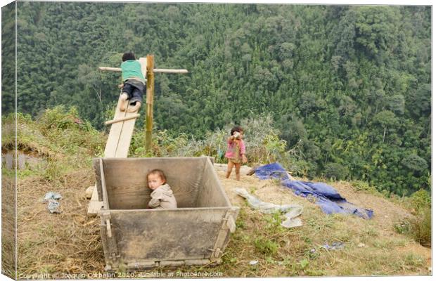 Children from villages in the mountainous area of ​​Sapa, north of Vietnam, expecting to see Western tourists. Canvas Print by Joaquin Corbalan