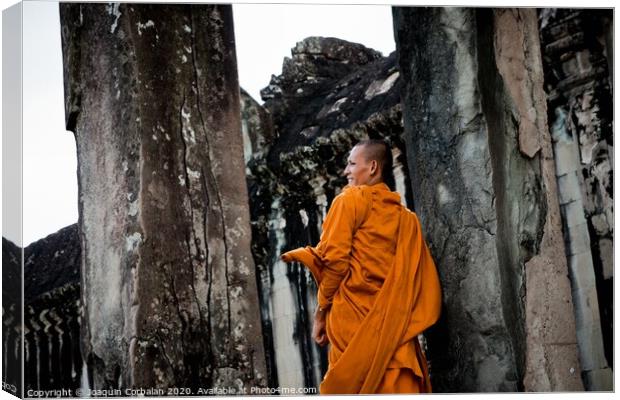 Khsach Kandal, Cambodia - 28 October 2011: Tibetan monks in orange robes visiting remote Cambodian temples to meditate. Canvas Print by Joaquin Corbalan