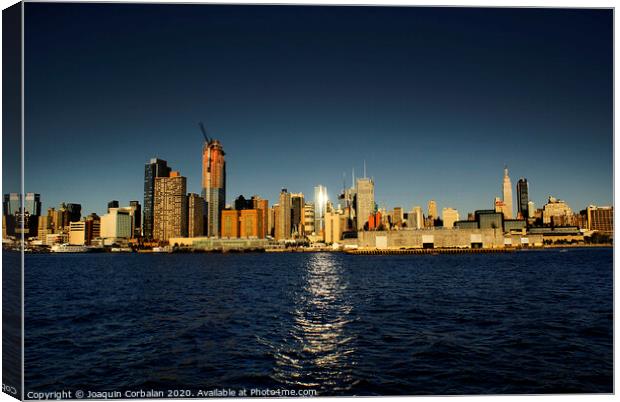view of Riverside Park next to the city skyline at sunset from the Hudson River. Canvas Print by Joaquin Corbalan