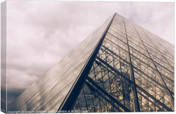 Crystal pyramid in Paris, sample of modern architecture on a cloudy day Canvas Print by Joaquin Corbalan