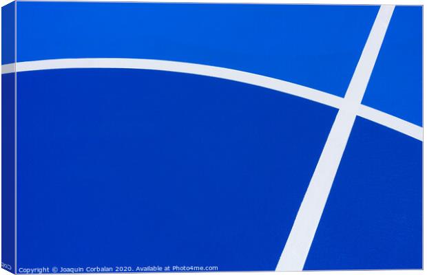 Background with cement texture painted blue, with white curved lines of a minimalist pattern with copy space. Canvas Print by Joaquin Corbalan