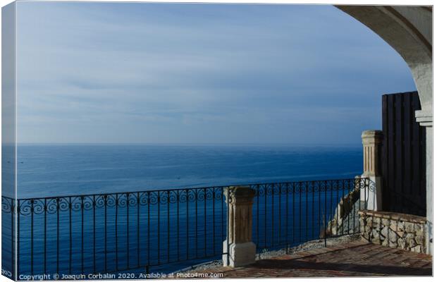 Calm blue sea without waves seen from a cliff with room for text Canvas Print by Joaquin Corbalan