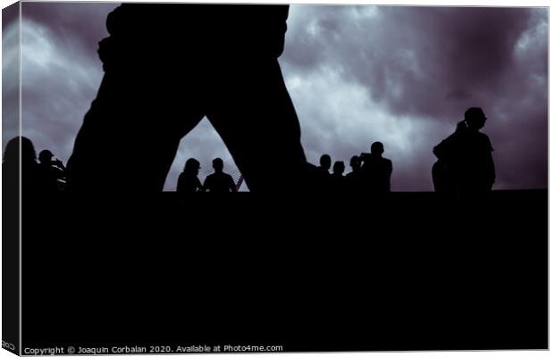 Backlight of a cloudy day with a silhouettes of a group of unrecognizable people. Canvas Print by Joaquin Corbalan