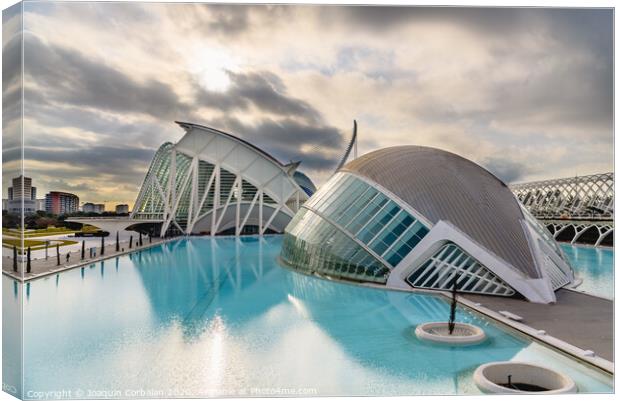 Panoramic cinema in the city of sciences of Valencia, Spain, visited by tourists next to the museum of sciences of the city in the background, at dawn with clouds and sun. Canvas Print by Joaquin Corbalan