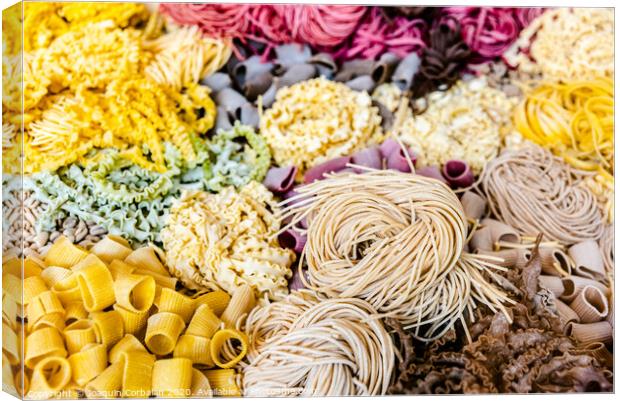 Many types of uncooked Italian pasta of various colors and shapes Canvas Print by Joaquin Corbalan