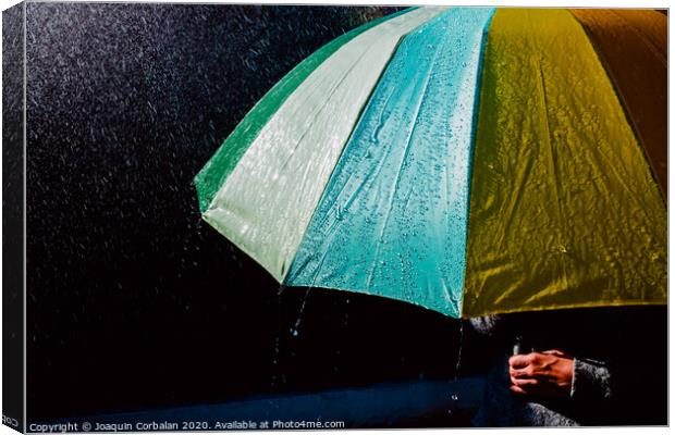 Detail of an umbrella with raindrops after a rainy day. Canvas Print by Joaquin Corbalan