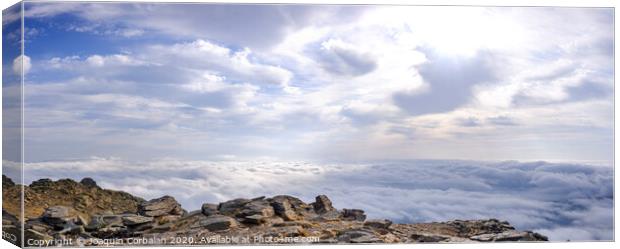 A day above the clouds at the top of the Peñarala mountain in Madrid, a mountaineering and adventure excursion. Canvas Print by Joaquin Corbalan