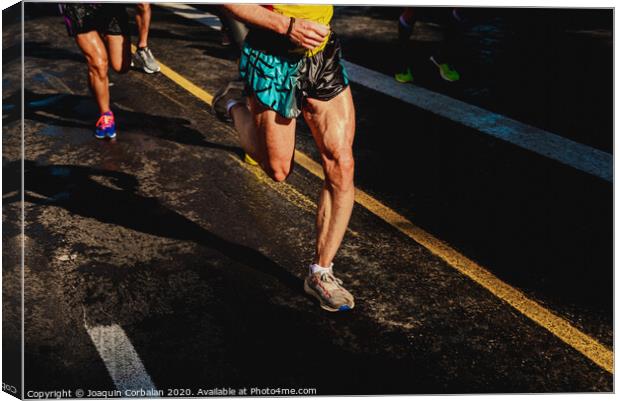 Running athletes have powerful quadriceps and calf muscles for running on asphalt. Canvas Print by Joaquin Corbalan