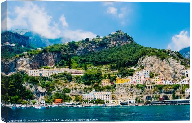 View from the sea of this picturesque Italian Mediterranean city, with old and colorful houses built on the side of a hill. Canvas Print by Joaquin Corbalan