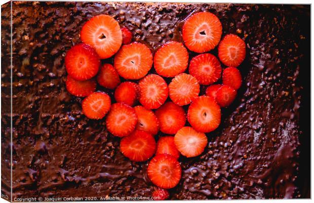 Sliced strawberry cut on a cake on a tray before baking it, with a heart shape. Canvas Print by Joaquin Corbalan