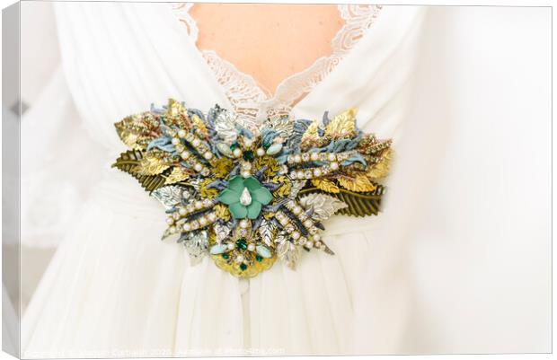 Flower shaped brooch made with small gemstones for a wedding dress. Canvas Print by Joaquin Corbalan