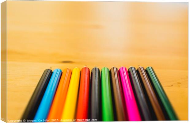 Colored pencils ordered to paint at school. Canvas Print by Joaquin Corbalan