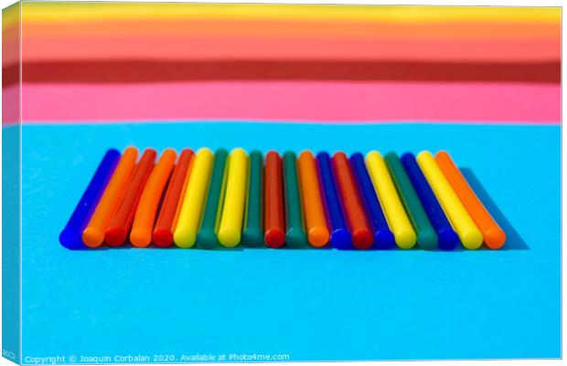 Colorful background of plastic bars, silicone glue, on a background of colored lines. Canvas Print by Joaquin Corbalan