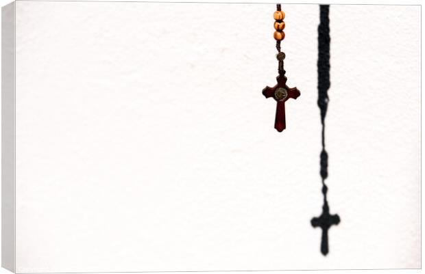 Rosary with wooden beads and Christian cross. Canvas Print by Joaquin Corbalan