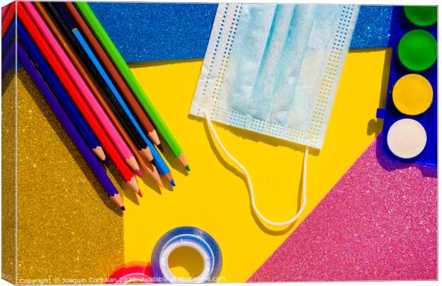 Creativity at school is developed with colorful materials and with the protection of a mask to avoid contagion, flat lay background. Canvas Print by Joaquin Corbalan