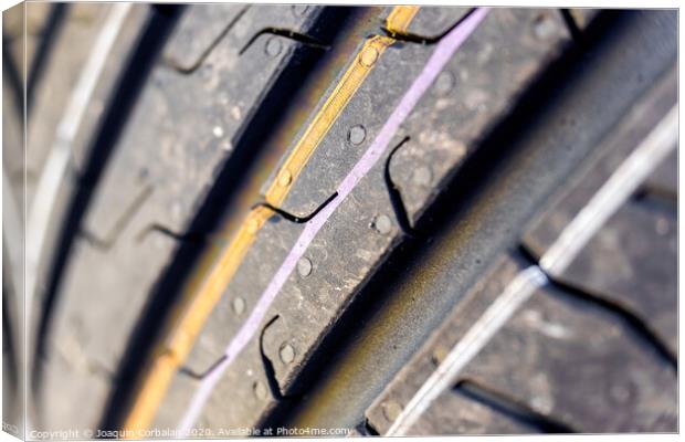 Detail of the grooves of a new car tire. Canvas Print by Joaquin Corbalan