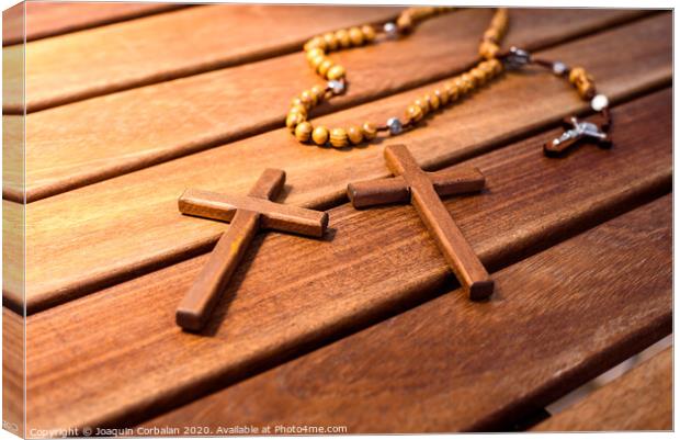 Rosary with wooden beads and Christian cross. Canvas Print by Joaquin Corbalan