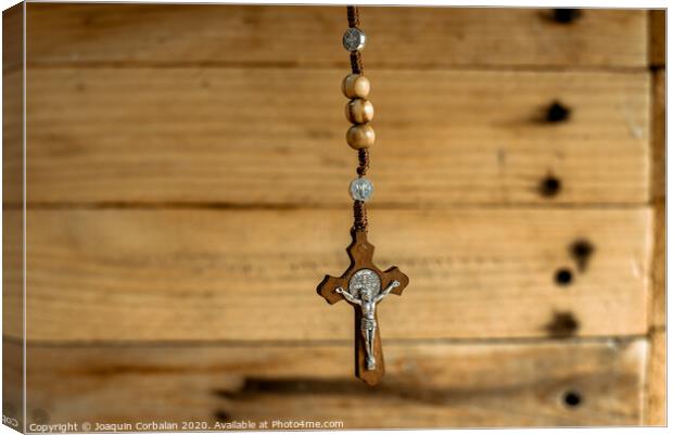 Rosary with wooden beads and Christian cross. Canvas Print by Joaquin Corbalan