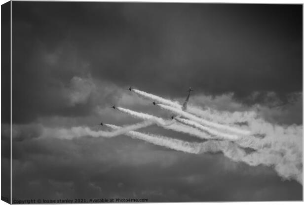  Red arrows flying in stormy clouds  Canvas Print by louise stanley