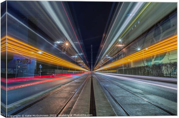 Passing light trails from 2 trams in Manchester Canvas Print by Katie McGuinness