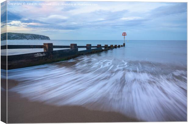 Swanage beach sunset Canvas Print by Katie McGuinness