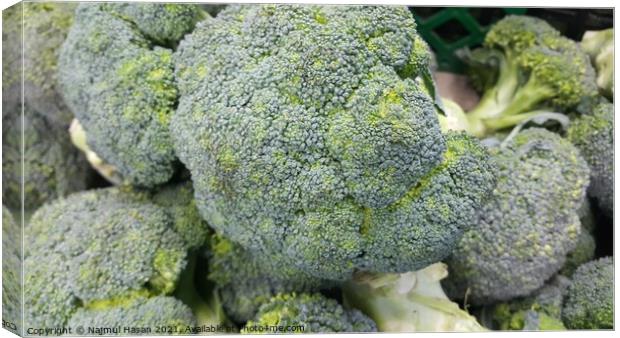 Green fresh broccoli pile placed in market for sale. Canvas Print by Photo Chowk