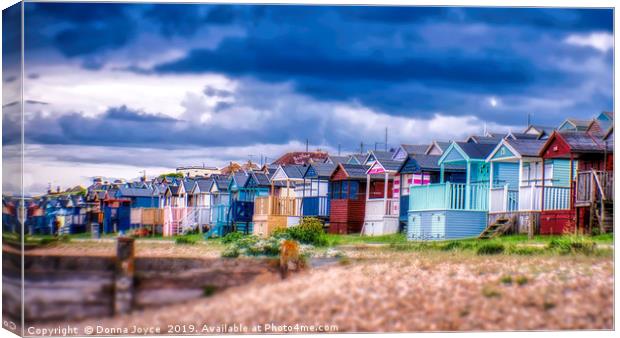 Beach huts at Tankerton slopes near Whitstable Canvas Print by Donna Joyce