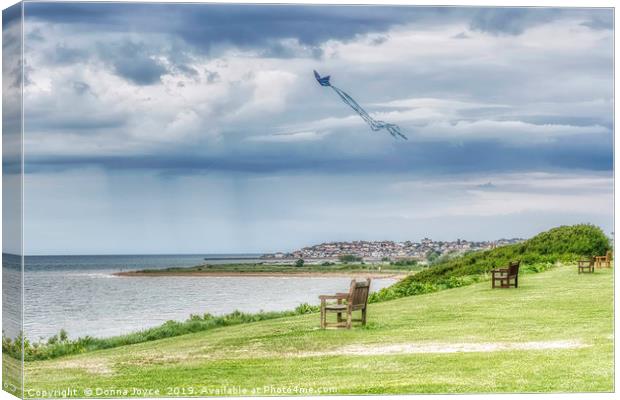 Kite flying over Tankerton slopes in Kent Canvas Print by Donna Joyce